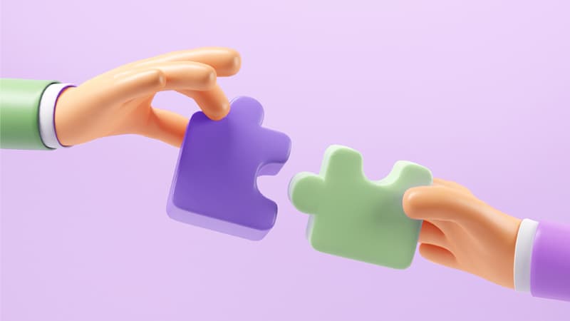 Illustration of two hands connecting puzzle pieces