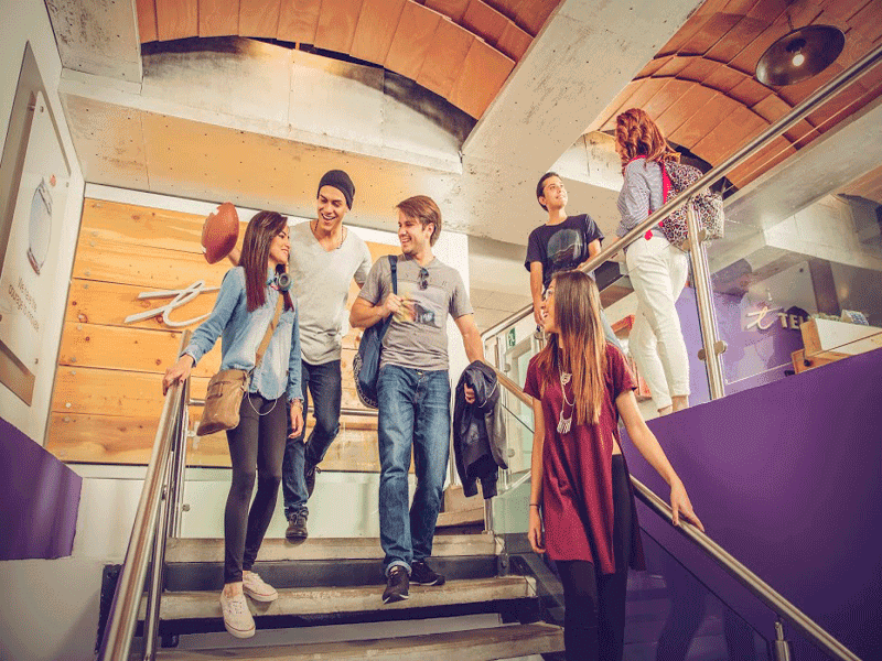 Central America team members walking downstairs