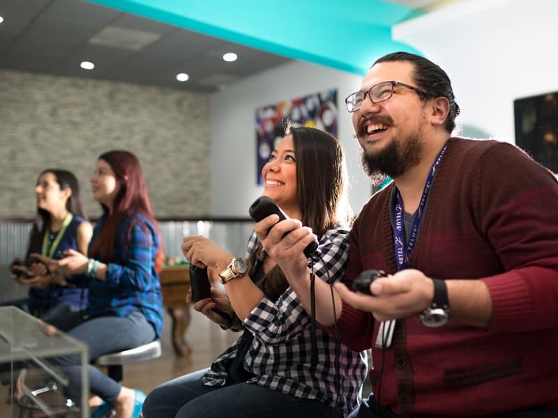 Team members playing video games