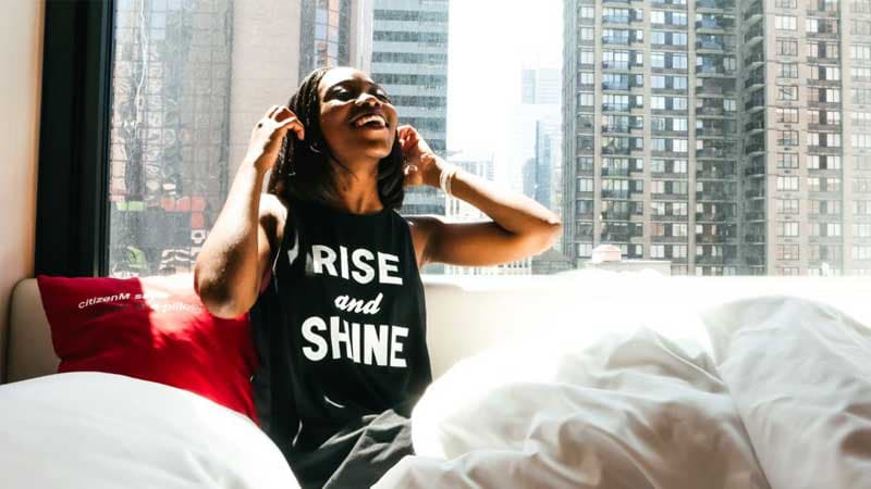 guest in bed at a Citizen M hotel