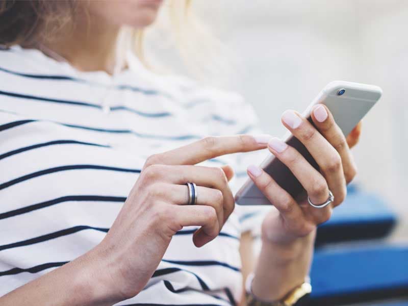 Woman using an iPhone