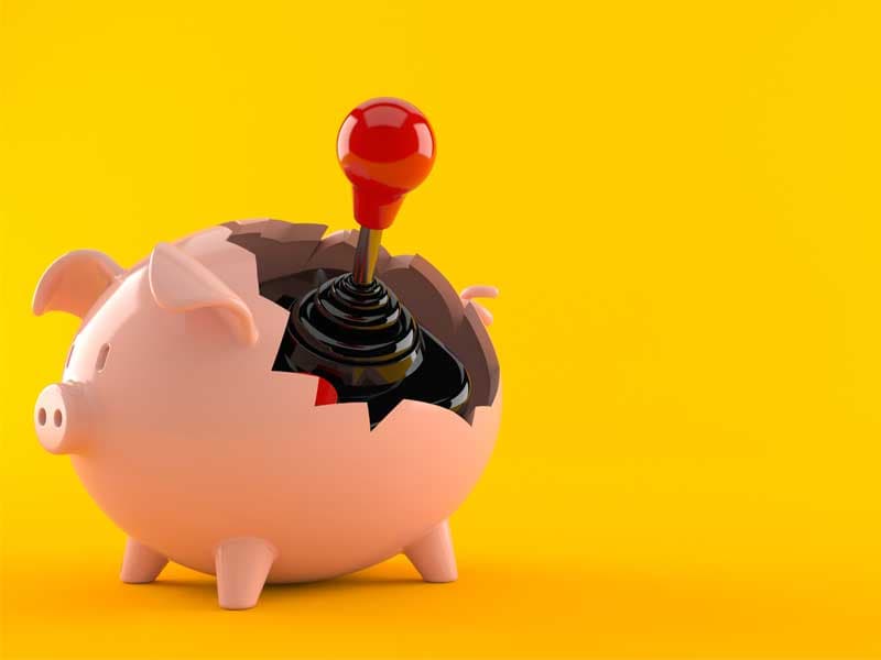 piggy bank and gaming controller