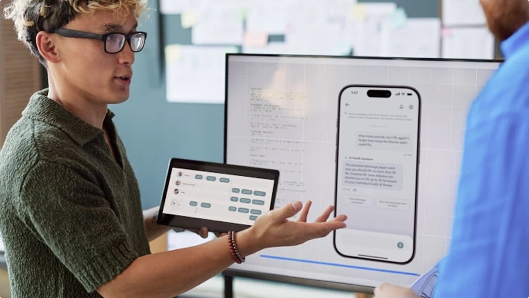 Someone presenting a mobile app during development