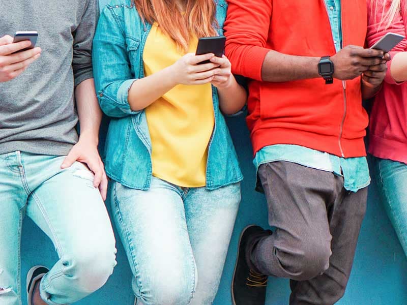 Group of people using smartphones
