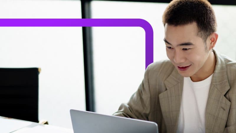 Happy man working on laptop